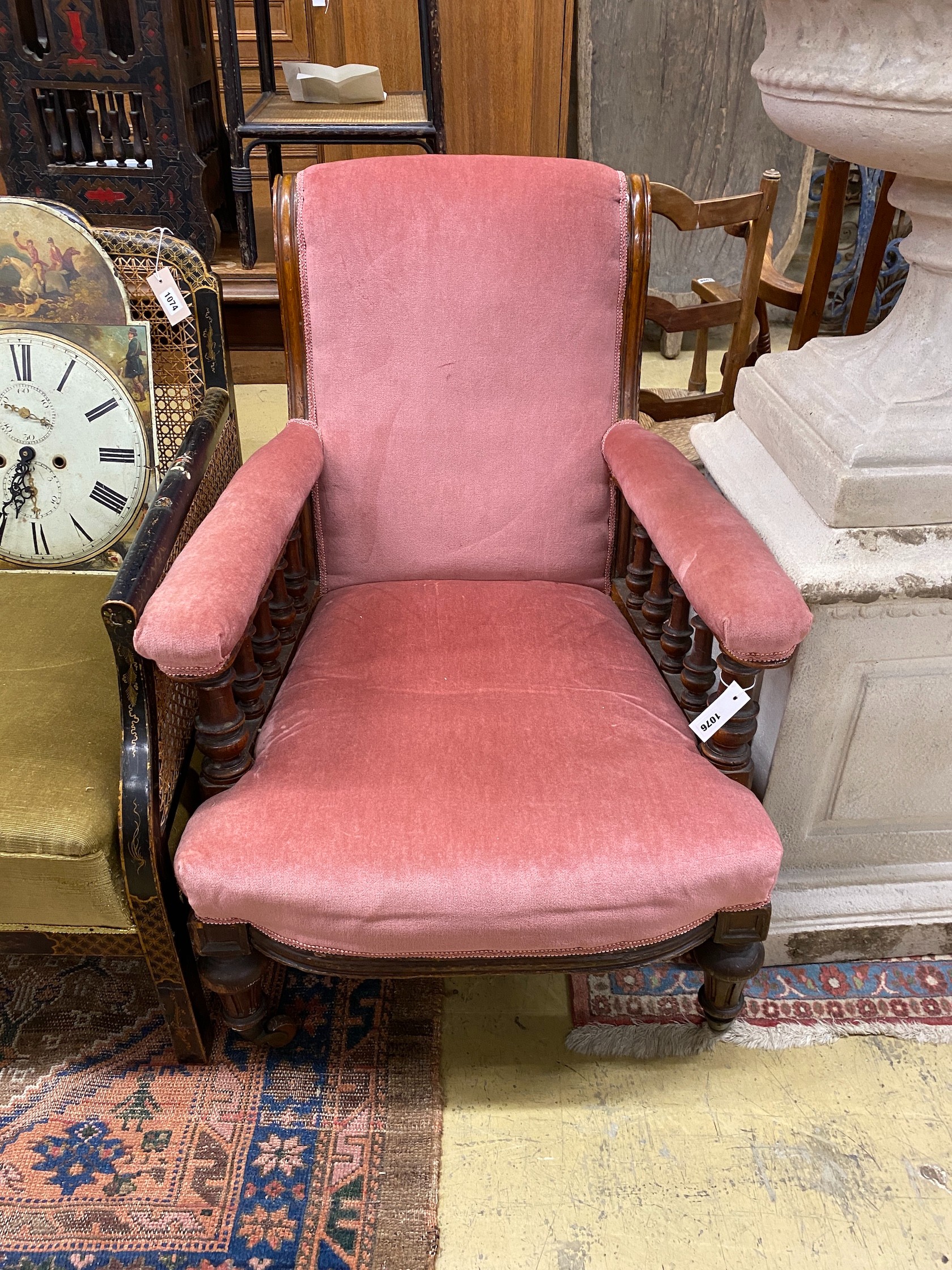 A late Victorian upholstered walnut open armchair, width 68cm, depth 84cm, height 90cm